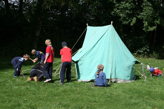 Pitching a green patrol tent