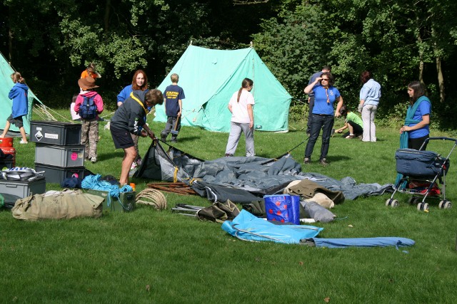 Leaders unfolding a tent